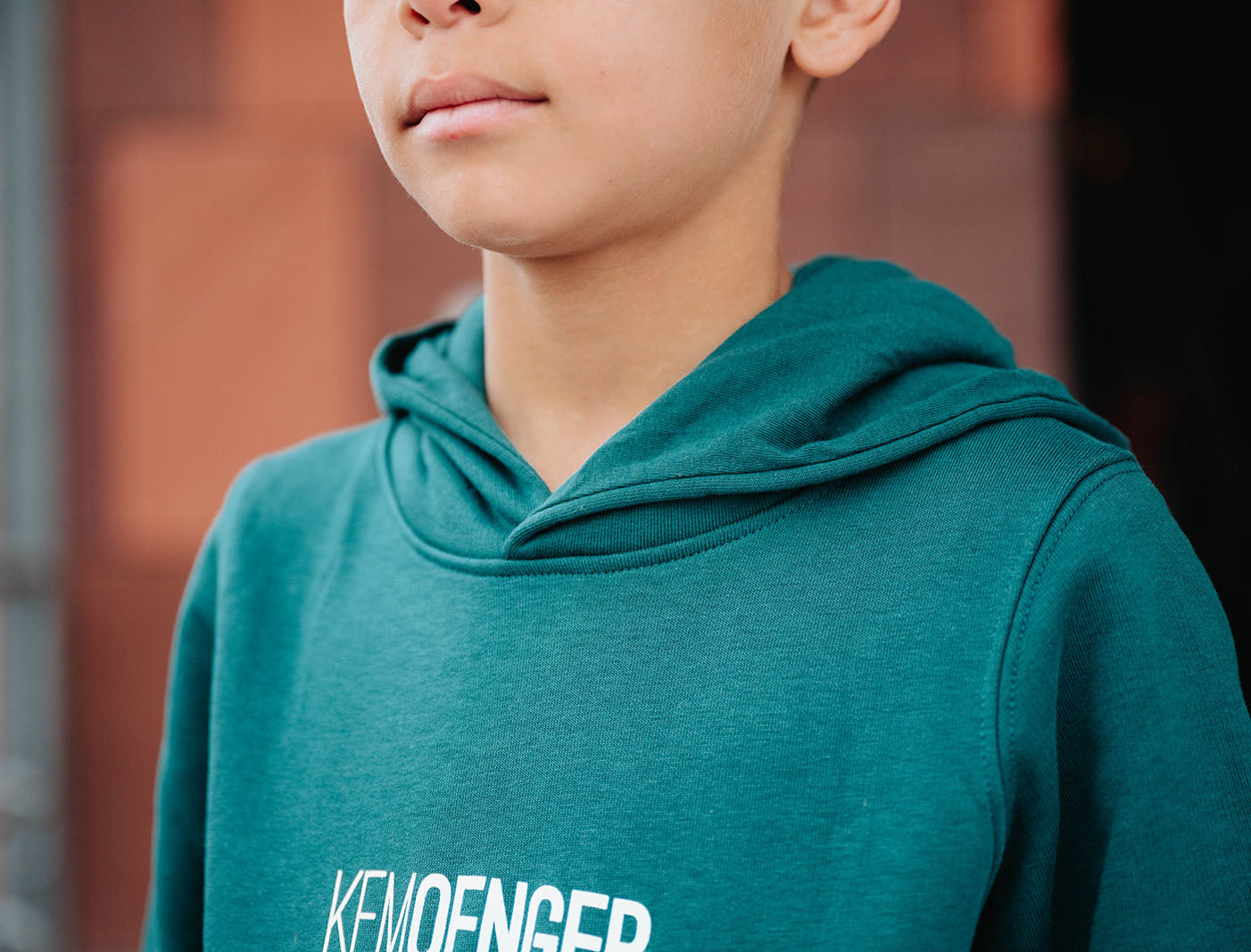 Close-up van een groene hoodie.