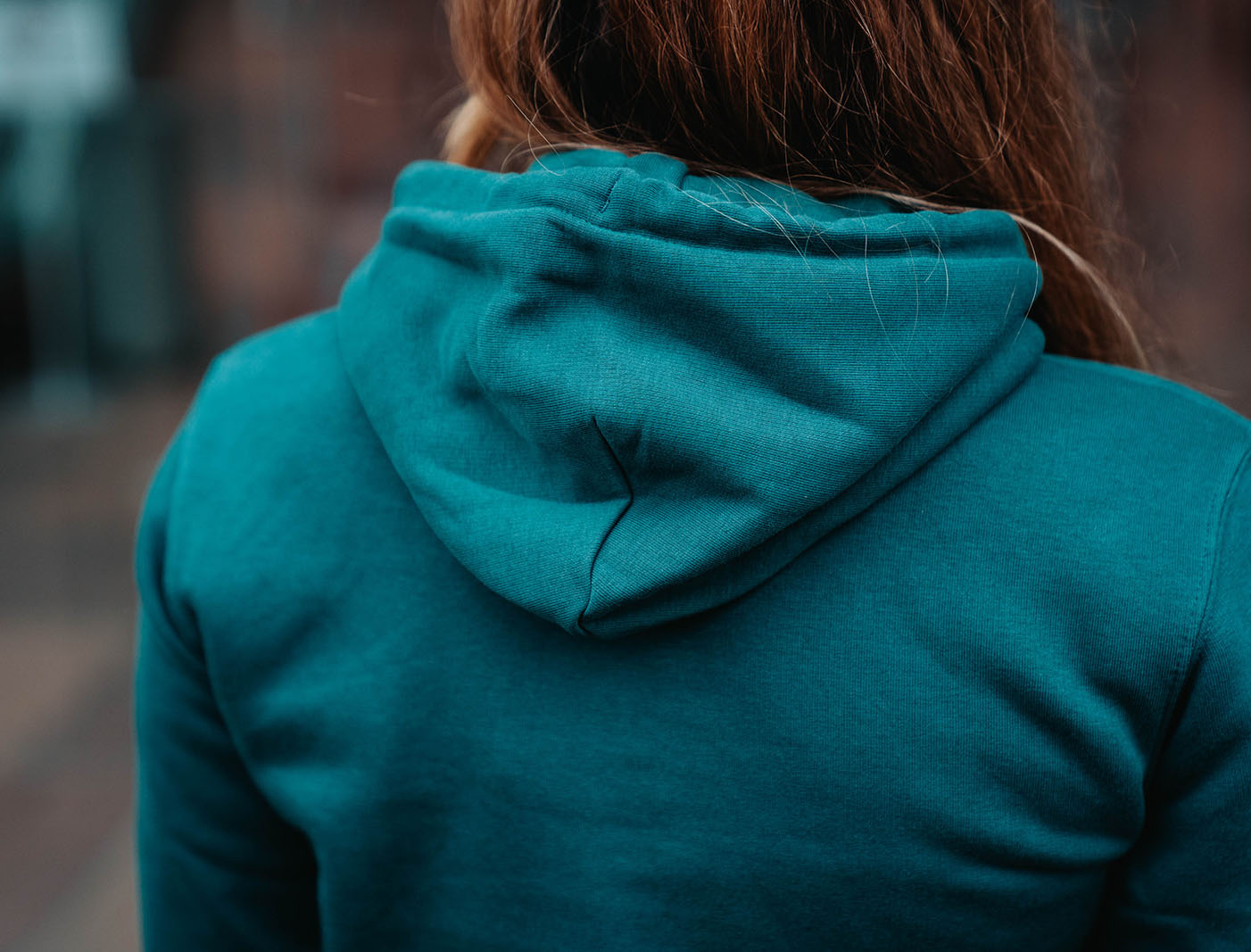 Close-up van een groene hoodie.