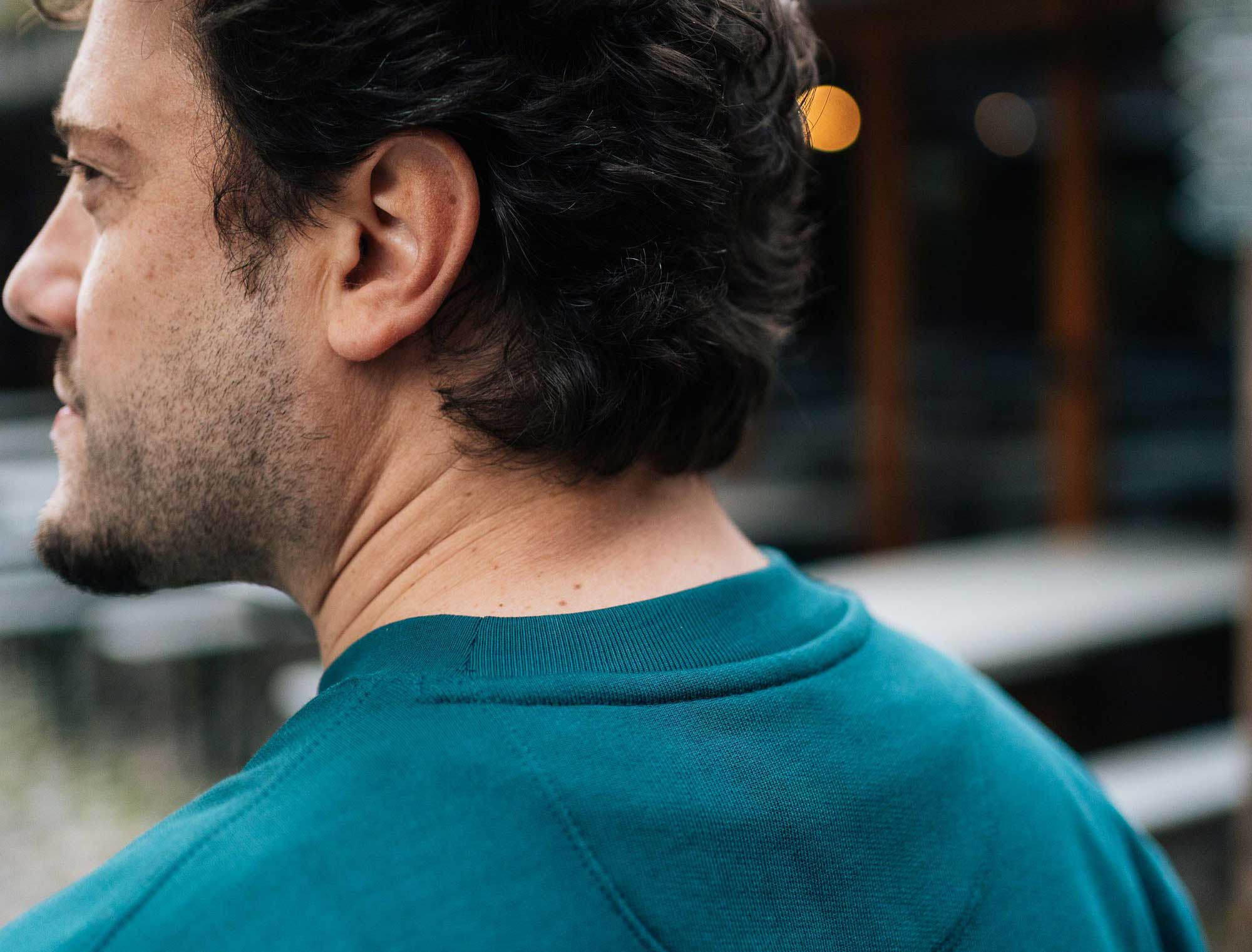 Detail van een groene sweater