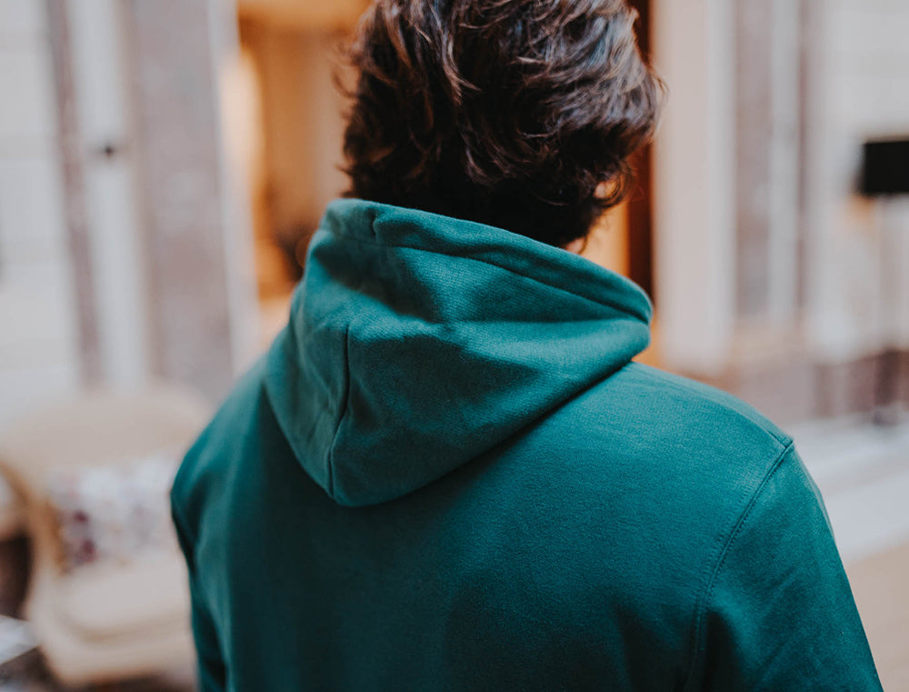 Close-up van een groene hoodie.